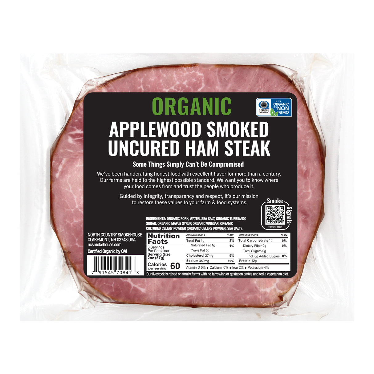 Packaged organic applewood smoked uncured ham steak with a label on a white background