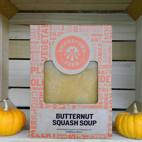 Butternut squash soup package with pumpkins on a wooden surface