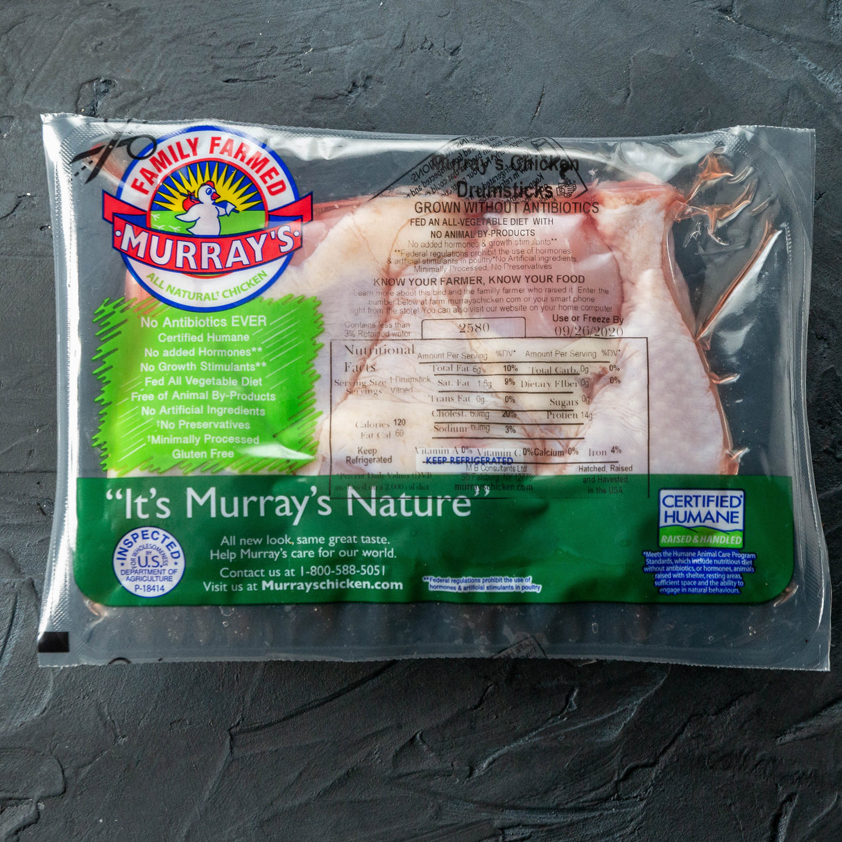 Packaged meat with Murray's Farms label on a dark surface