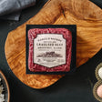 Package of Force of Nature grass fed beef on a wooden cutting board