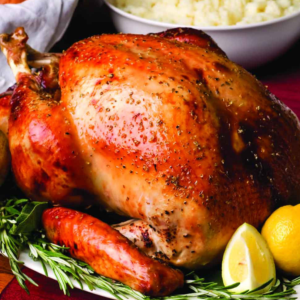 Roasted turkey with sides on a table