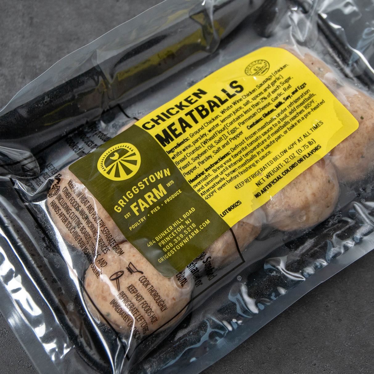 Packaged chicken meatballs with a label on a gray background