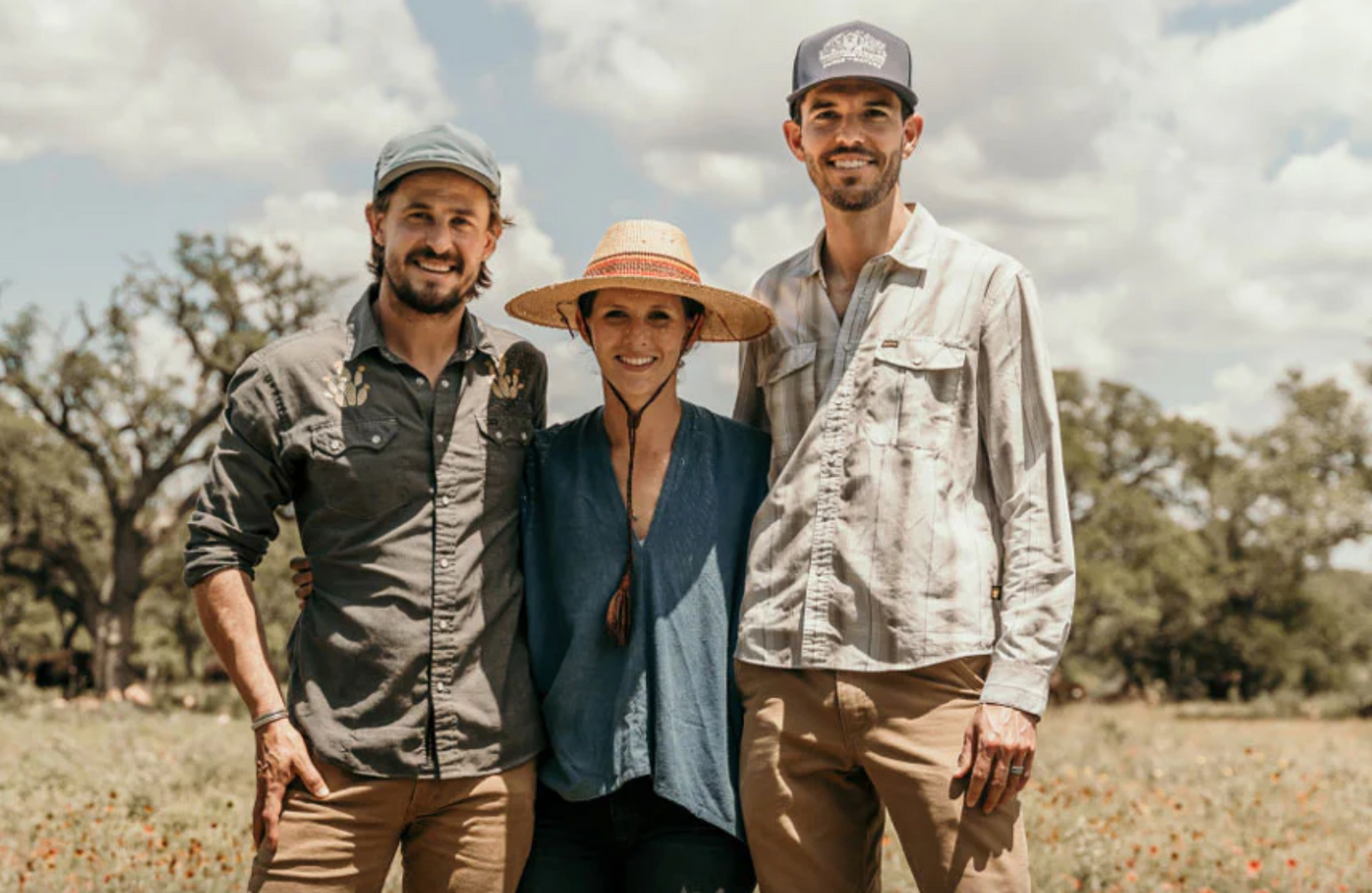 Force of nature founders standing on regenerative farm