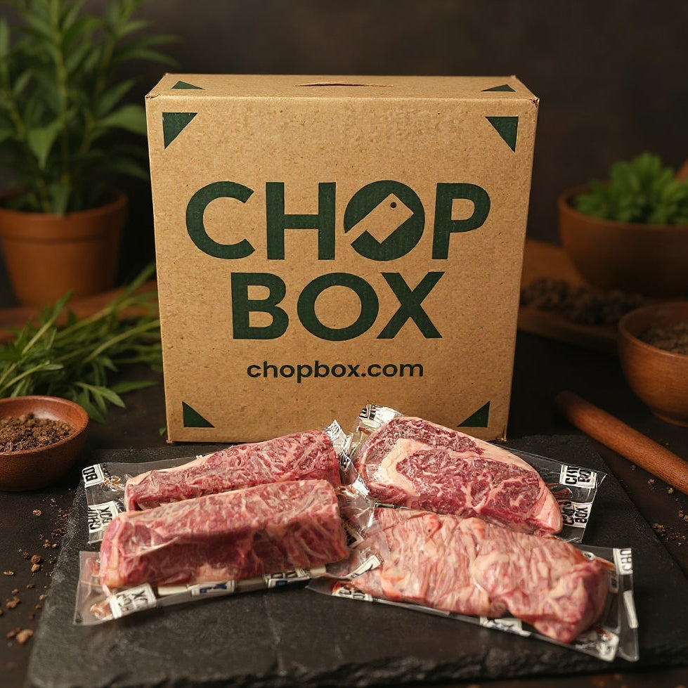 Chop Box packaging with raw meat on a dark surface