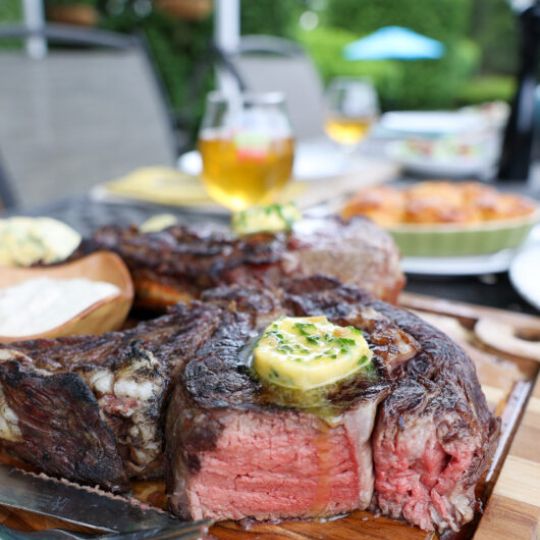 GRILLED MINI BONE TOMAHAWK STEAK WITH COMPOUND BUTTER