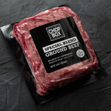 Packaged ground beef from Chop Box on a dark surface